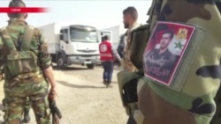 В осажденную Асадом Восточную Гуту прибыл первый гуманитарный конвой от "Красного полумесяца" В осажденную Асадом Восточную Гуту прибыл первый гуманитарный конвой от "Красного полумесяца"