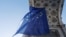 The Belgian Council presidency raises a giant EU flag under the Cinquantenaire Arch, in Brussels on January 19, 2024.
